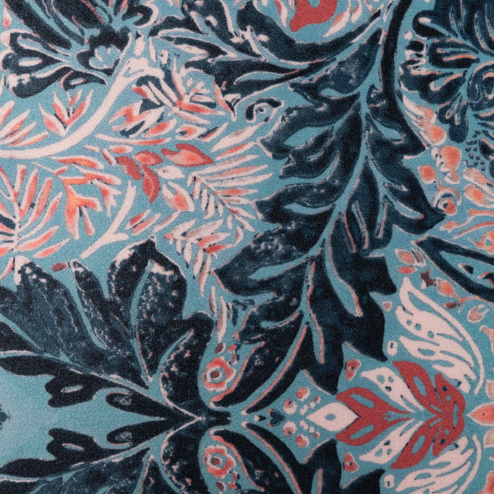 Closeup image of velvet cushion with fringes in blue colour by Scatter Box. 